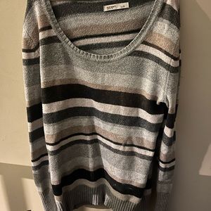 Neutral tones, gray, black, tan sweater